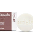 Arista strengthening shampoo bar and packaging on a white background