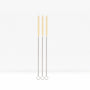 Three cotton straw cleaning brushes with twisted metal handles standing upright against a white background.